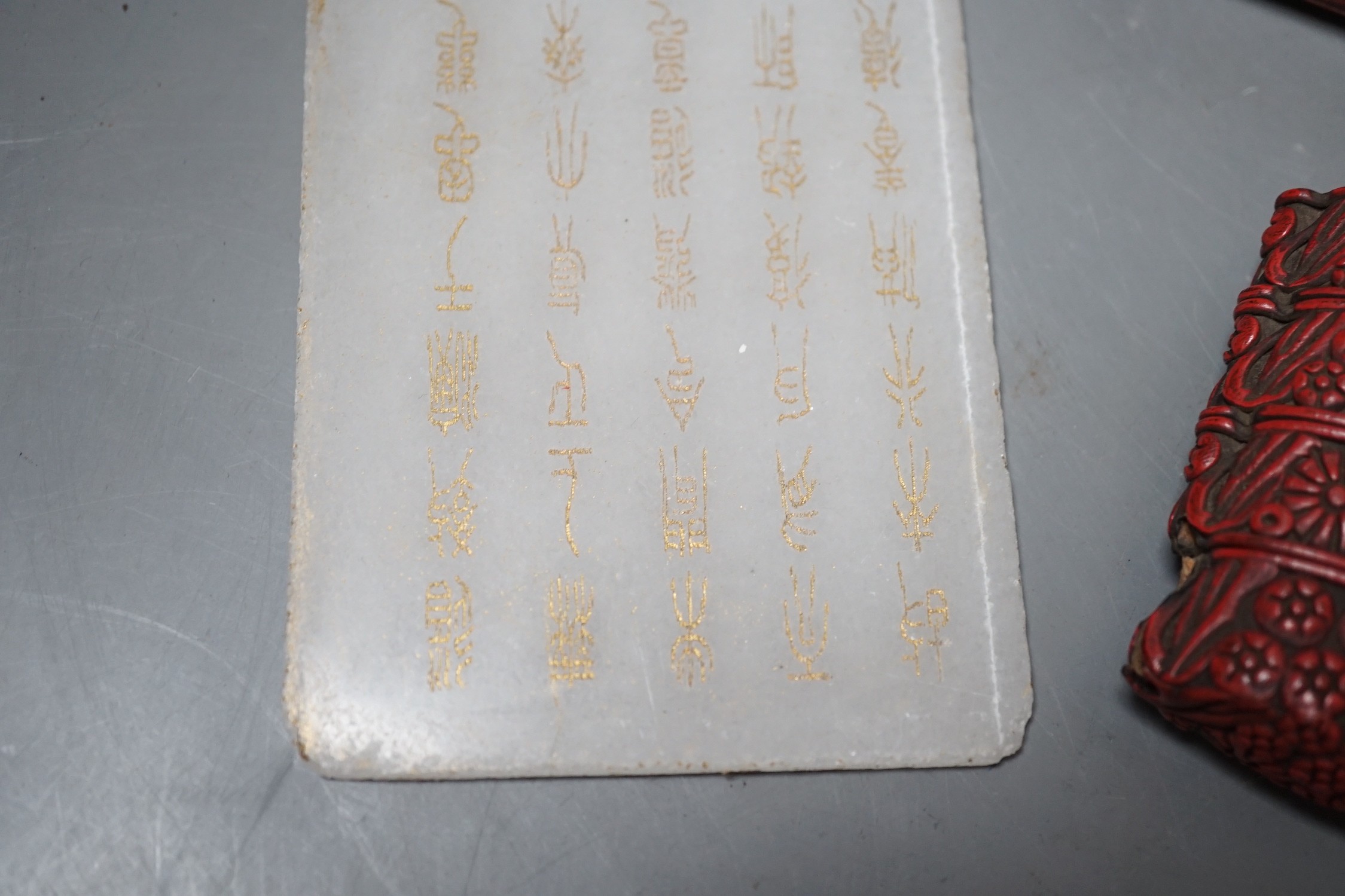 A Chinese hardstone plaque with inscription, 16 x 8cm, together with two lacquer items (3)